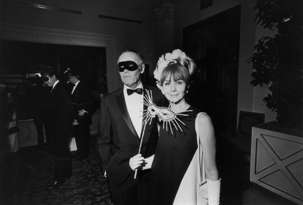 28th November 1966: American actor Henry Fonda (1905 - 1982) and his fifth wife, Shirlee Mae Adams, at Truman Capote's Black-and-White Ball in the Grand Ballroom of the Plaza Hotel, New York City. They are dressed formally and carry eyemasks. 