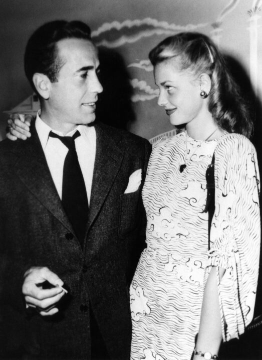 DEAD RECKONING, Humphrey Bogart, with wife Lauren Bacall, on set, 1947