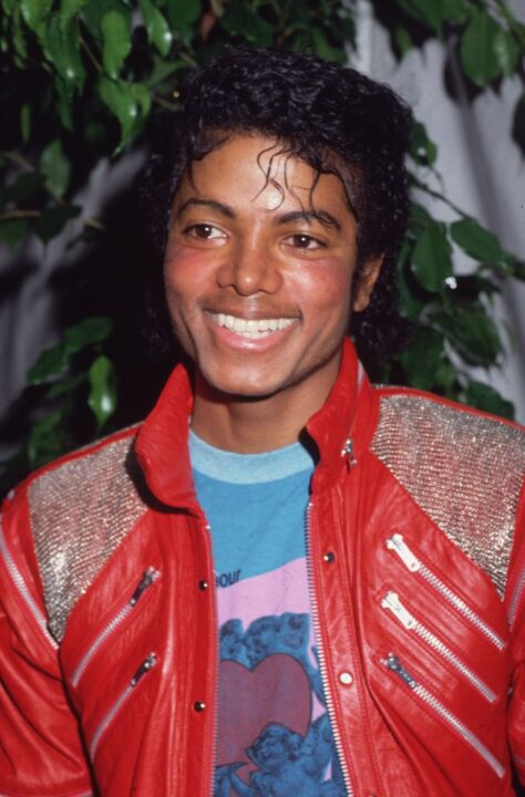 1983: Portrait of American pop star Michael Jackson wearing a red leather jacket at the opening of the stage musical, 'Dream Girls,' Los Angeles, California