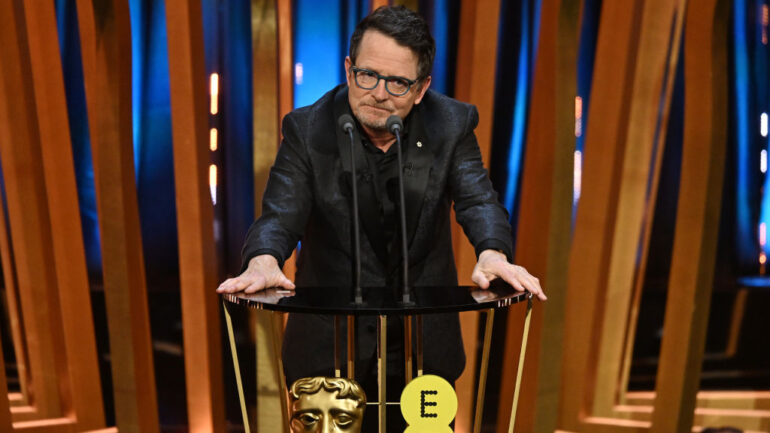 Michael J Fox presents the Best Film Award on stage during the EE BAFTA Film Awards 2024 at The Royal Festival Hall on February 18, 2024
