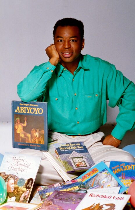 Reading Rainbow LeVar Burton poses with books featured on the show during its first ten years in a photo celebrating the show's 10th anniversary, (1993), 1983-2006