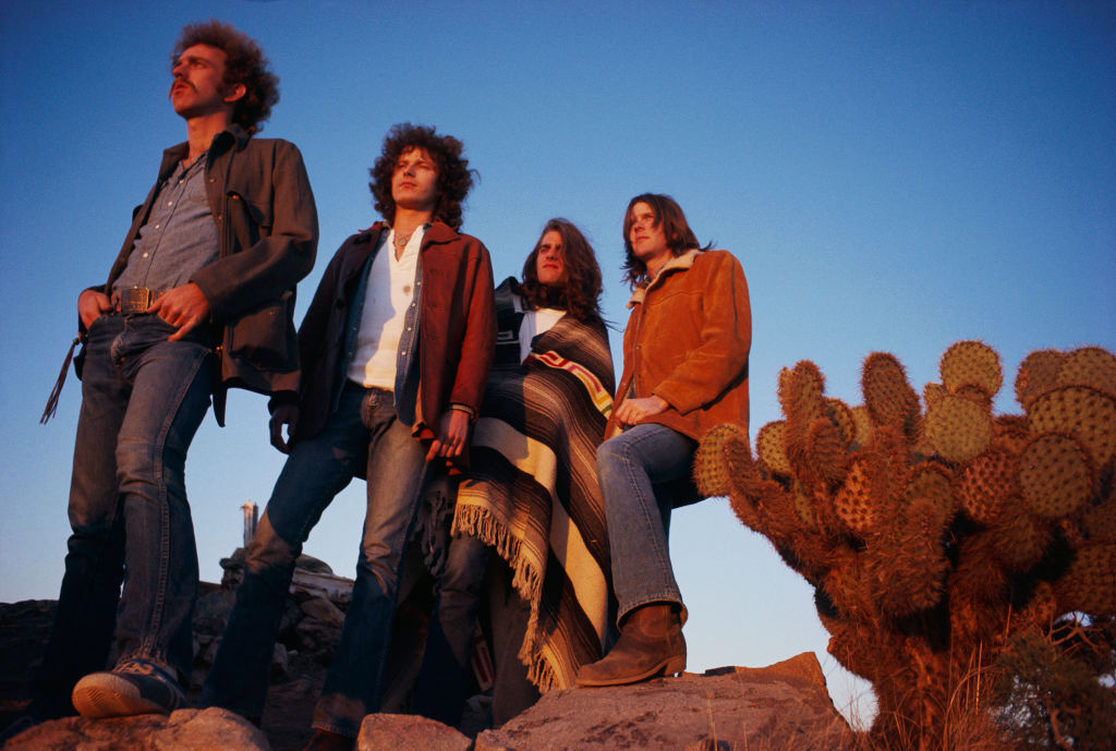March 1972 --- The rock band The Eagles rest in a desert valley. The Eagles were the most popular band of the seventies and their reunion tour in the nineties was also very successful. L-R: Bernie Leadon, Don Henley, Glenn Frey, and Randy Meisner