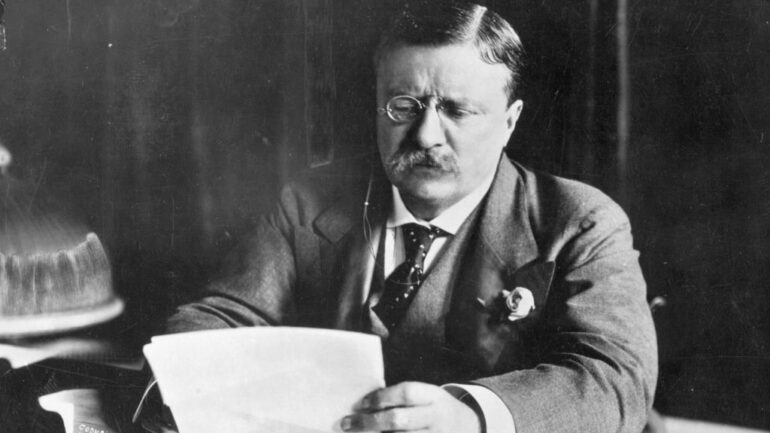 circa 1905: Theodore Roosevelt (1858 - 1919),the 26th President of the United States (1901-09) sitting at his desk working