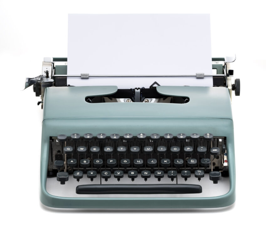 vintage typewriter with blank paper to write text, isolated