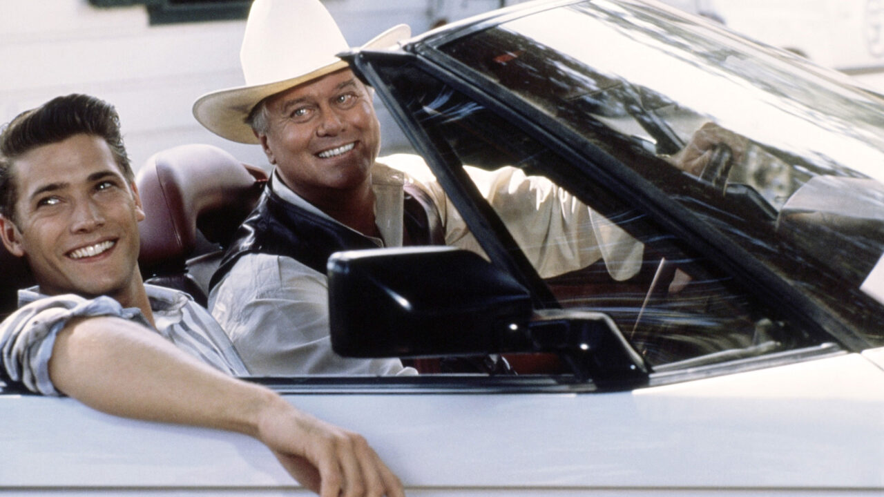 DALLAS, from left, Sasha Mitchell, Larry Hagman, 1978-91 (1990 photo). 