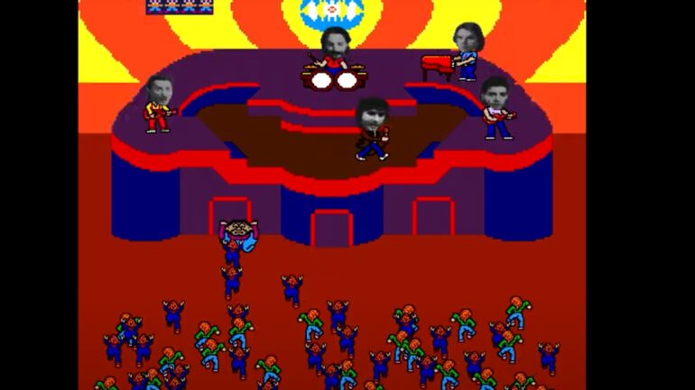 screenshot from the 1983 Bally Midway arcade video game Journey. It depicts video game versions of members of the rock band Journey with black-and-white digitized photos of their actual faces on top of their computer graphic-created bodies. The band is performing onstage in front of a wild audience, with a bouncer attempting to keep them from reaching the stage.