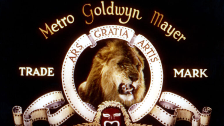 image of the MGM studio's opening logo during the 1950s, featuring the lion roaring in the center of a circle, around which reads: 