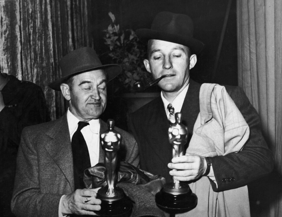 Irish-born actor Barry Fitzgerald (1888 - 1966) (left) holds his Oscar for Best Supporting Actor while American actor Bing Crosby (1904 - 1977) holds his Oscar for Best Actor, both for their roles in 'Going My Way,' Academy Awards, Los Angeles, California, March 15, 1945.