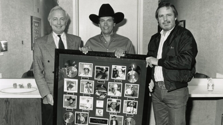 Bruce Hinton of MCA, George Strait and Erv Woolsey, circa 1991