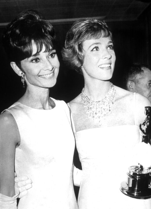British actor Julie Andrews (right) holds her Oscar while standing with Belgian born actor Audrey Hepburn (1929 - 1983) at the Academy Awards ceremonies in Santa Monica, California, April 5, 1965. Andrews won Best Actress for her performance in the film, 'Mary Poppins,' directed by Robert Stephenson.
