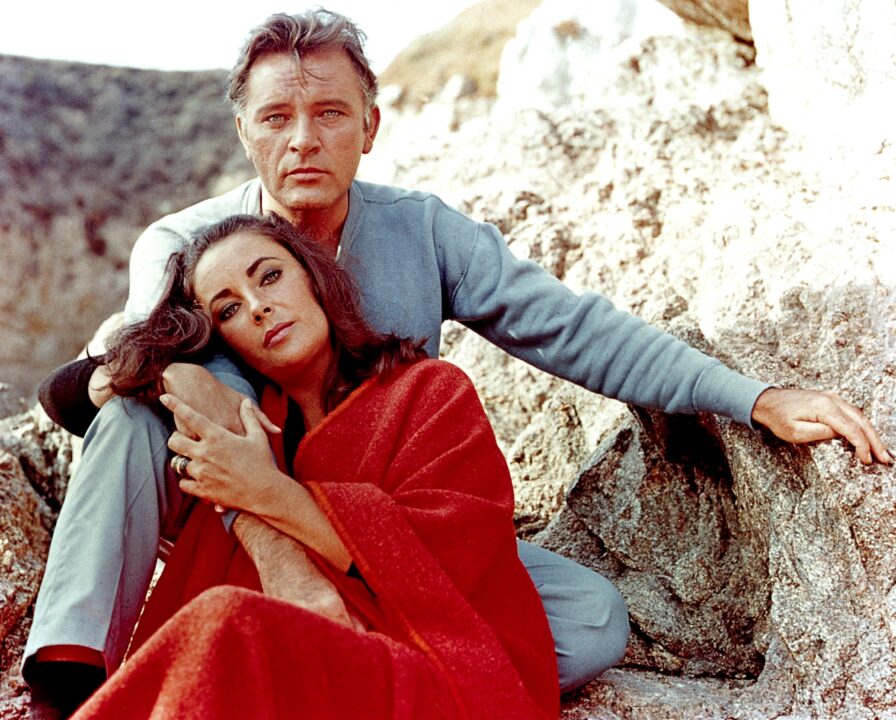 Elizabeth Taylor and Richard Burton on the film set of "The Sandpiper" in 1965. 