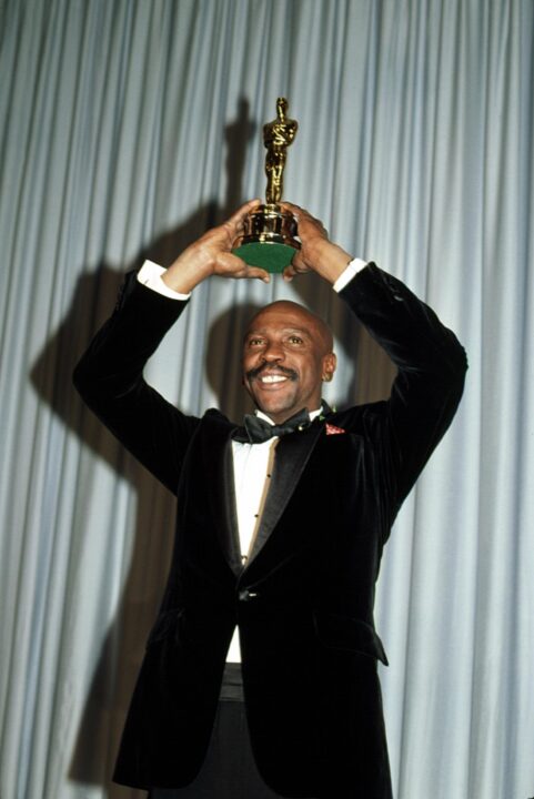 Louis Gossett Jr. holds his Best Supporting Actor Oscar for An Officer and a Gentleman