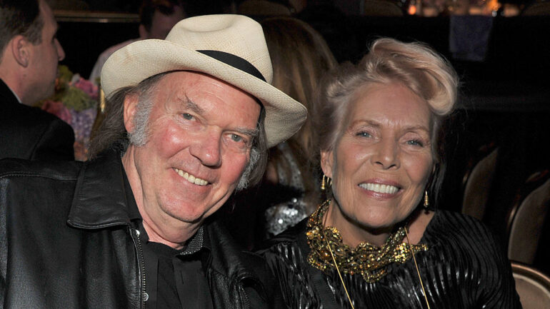 Singers Neil Young (L) and Joni Mitchell attend Clive Davis and The Recording Academy's 2012 Pre-GRAMMY Gala and Salute to Industry Icons Honoring Richard Branson at The Beverly Hilton hotel on February 11, 2012 in Beverly Hills, California