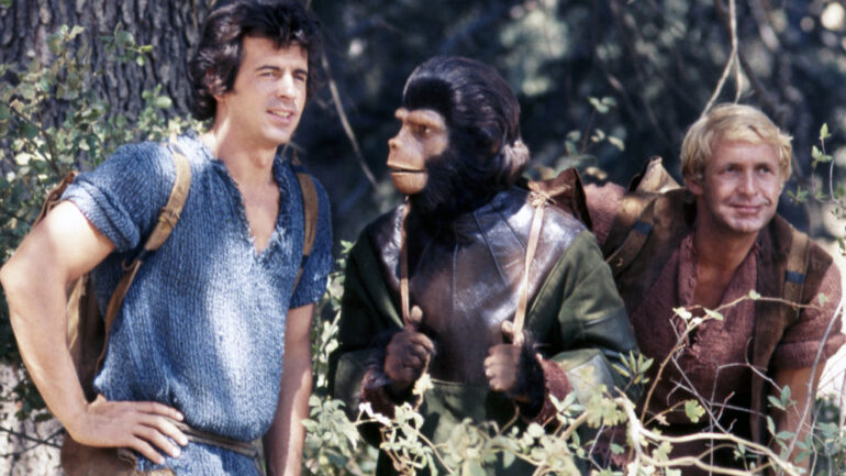 Ron Harper, Roddy McDowall (1928 - 1998) and James Naughton on the set of the US television series, 'Planet of the Apes', USA, circa 1974. The science fiction series starred Harper as 'Alan Virdon', McDowall as 'Galen', and Naughton as 'Pete Burke'.