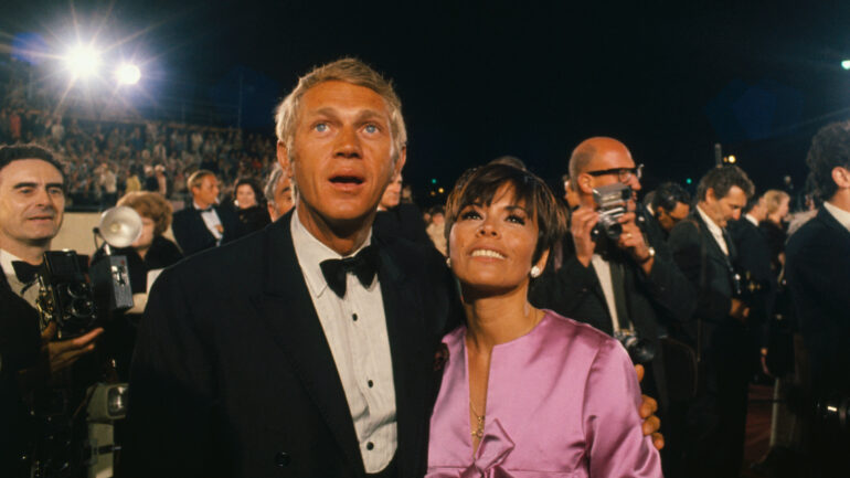 4/10/1967-Hollywood, CA-ORIGINAL CAPTION READS: Actor Steve McQueen and his wife arrive for the Academy Awards.