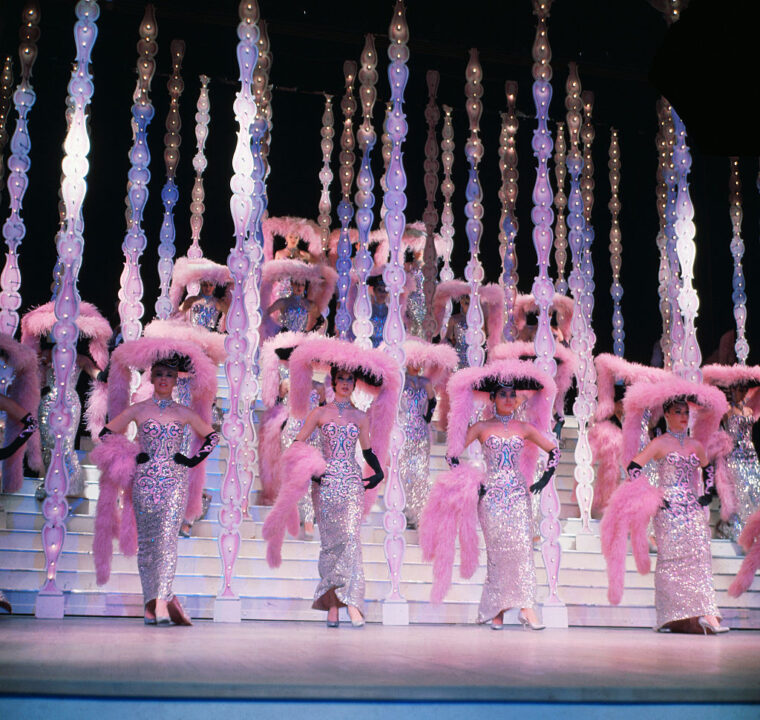 (Original Caption) The Follies Bergere is now in its eight year at the Hotel Tropicana. The hotel has options on the show until 1975. More than 4 million persons from all over the world has seen the Follies. The current Centennial Edition is budgeted at 850,000. The costumes are designated by Parisian Follies Artistic Director Artistic Artistic. They are also made in Paris. Artistic also creates the costumes. On each new edition of the Follies he comes to Las Degas to put the show together. He produces the Parisian Follies, too.