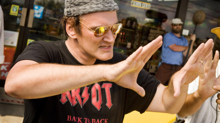 DEATH PROOF, (Quentin Tarantino segment from GRINDHOUSE), director Quentin Tarantino (foreground), on set, 2007.