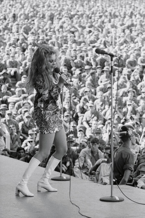 (Original Caption) Ann-Margret sings for some 20,000 servicemen at Long Binh December 22nd as Bob Hope launched his fifth annual Vietnam Christmas show at this base 15 miles from Saigon. Hope told the crowd, "I wanted to spend Christmas in the states but I can't stand violence"