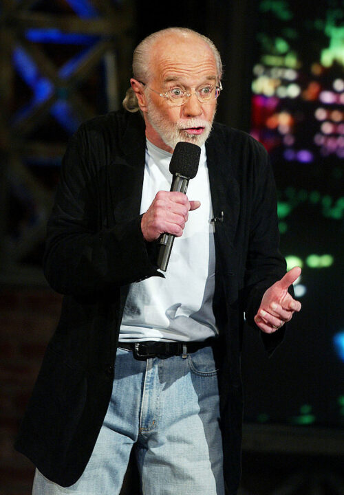 Comedian George Carlin appears on "The Tonight Show with Jay Leno" at the NBC Studios on October 8, 2003 in Burbank, California