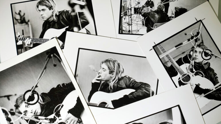 A selection of prints by Michel Linssen from the Redferns collection, depicting Kurt Cobain playing the guitar in a recording studio, pictured at the Getty Images Hulton Archive, London E16, 12th September 2023.