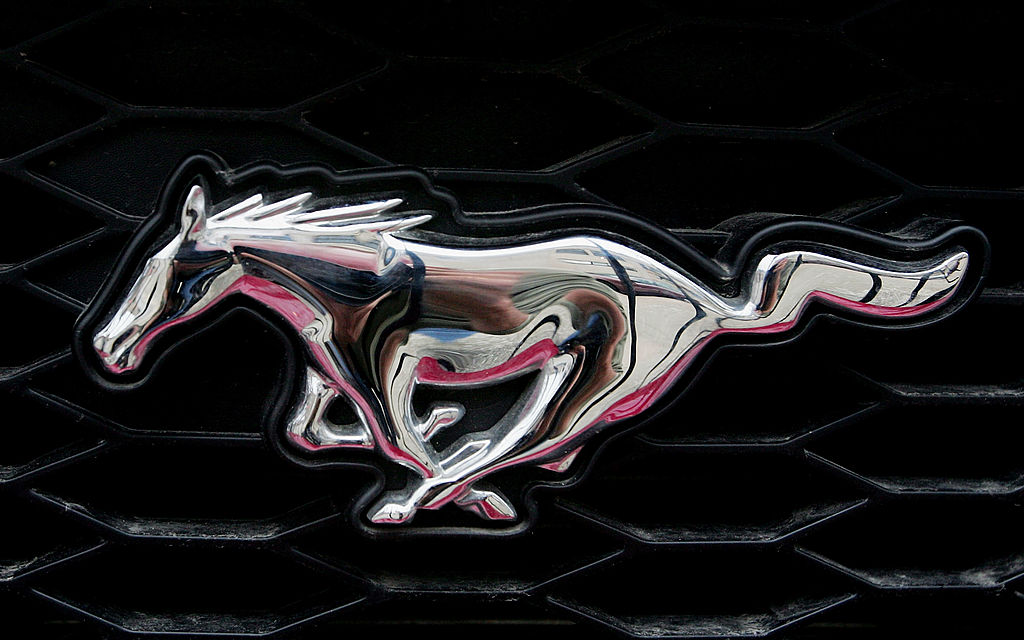 A logo is attached to the grill of a Ford Mustang sitting on the lot at Joyce Ford June 6, 2007 in Chicago, Illinois. The Mustang helped Ford edge out Toyota as the leader in the J.D. Powers and Associates? vehicle quality ranking. Other Ford vehicles that ranked high were the Lincoln Mark LT and MKZ, the Mercury Milan, and the Mazda MX-5 Miata