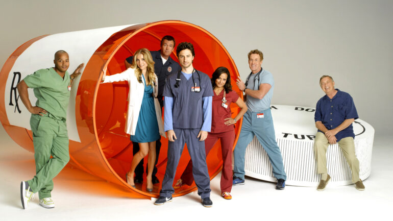 Scrubs (from left) Donald Faison, Sarah Chalke (in blue dress), Neil Flynn (behind her), Zach Braff (center, with stethoscope), Judy Reyes, John C. McGinley, Ken Jenkins, (Season 8), 2001-2010