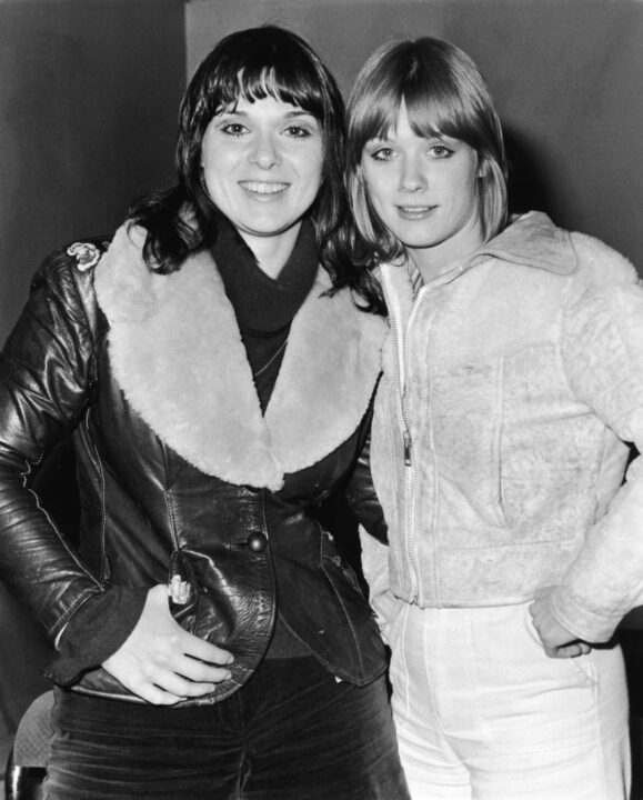 Portrait of sisters Ann and Nancy Wilson of the rock group Heart on tour in Europe, 1976