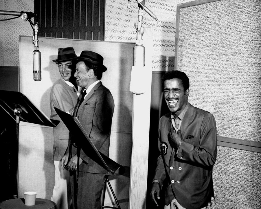 1962: Entertainers and members of the Rat Pack, (L-R) Dean Martin, Frank Sinatra and Sammy Davis, Jr. record in the studio in 1962. 