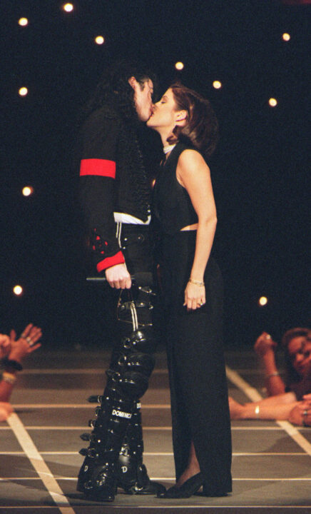 This September 8, 1994 file photo shows US pop star Michael Jackson and his then wife Lisa-Marie Presley kissing on the stage of Radio City Music Hall in New York where they attended the MTV Video Music Awards. Jackson died on June 25, 2009 after suffering a cardiac arrest, multiple US media outlets reported, sending shockwaves around the entertainment world. AFP PHOTO / Files