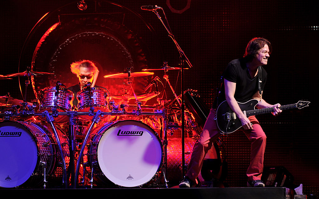 Musicians Alex Van Halen (L) and Eddie Van Halen of Van Halen perform at their dress rehearsal for family and friends at the Forum on February 8, 2012 in Inglewood, California