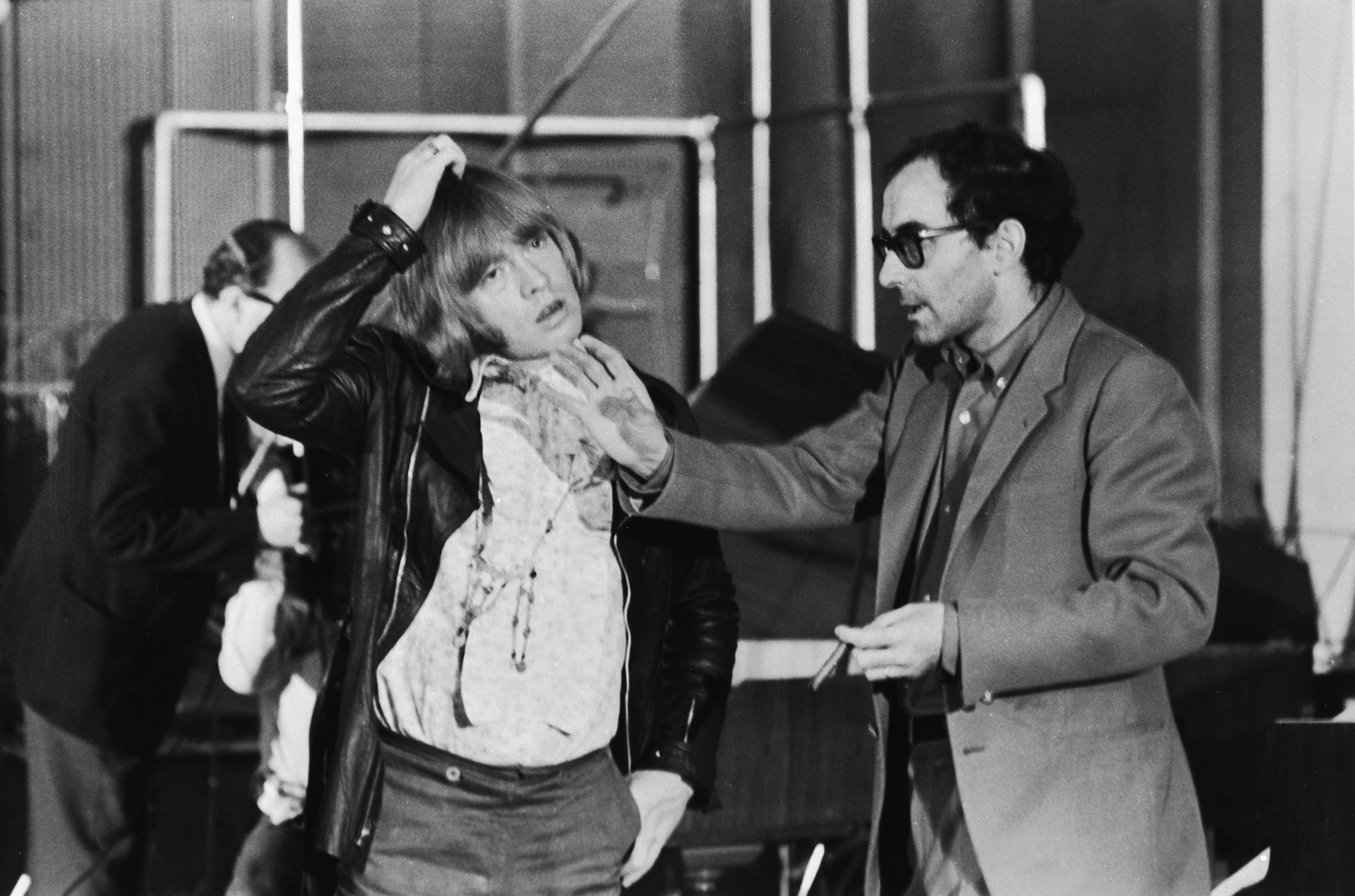 Jean-Luc Godard (right) directs Brian Jones (1942 - 1969) of the Rolling Stones during the shooting of the documentary film 'Sympathy For the Devil' (aka 'One Plus One'), 30th July 1968.