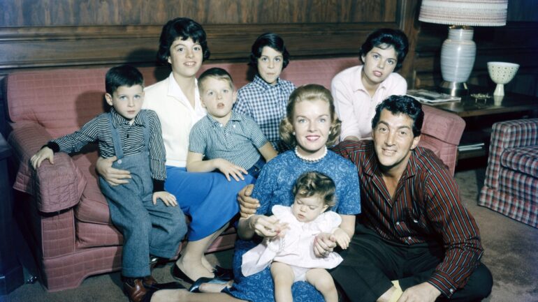 Dean Martin and family: (on couch from left:) Ricci, Claudia, Dean Jr. (Dino), Barbara; (on floor): Jeanne, Gina (baby), Dean, circa 1958.