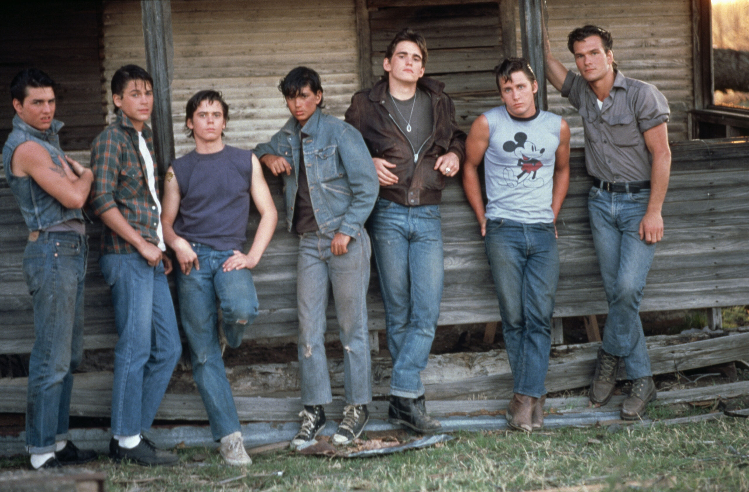 American actors Tom Cruise, Rob Lowe, C. Thomas Howell, Ralph Macchio, Matt Dillon, Emilio Estevez and Patrick Swayze on the set of The Outsiders, directed and produced by Francis Ford Coppola.