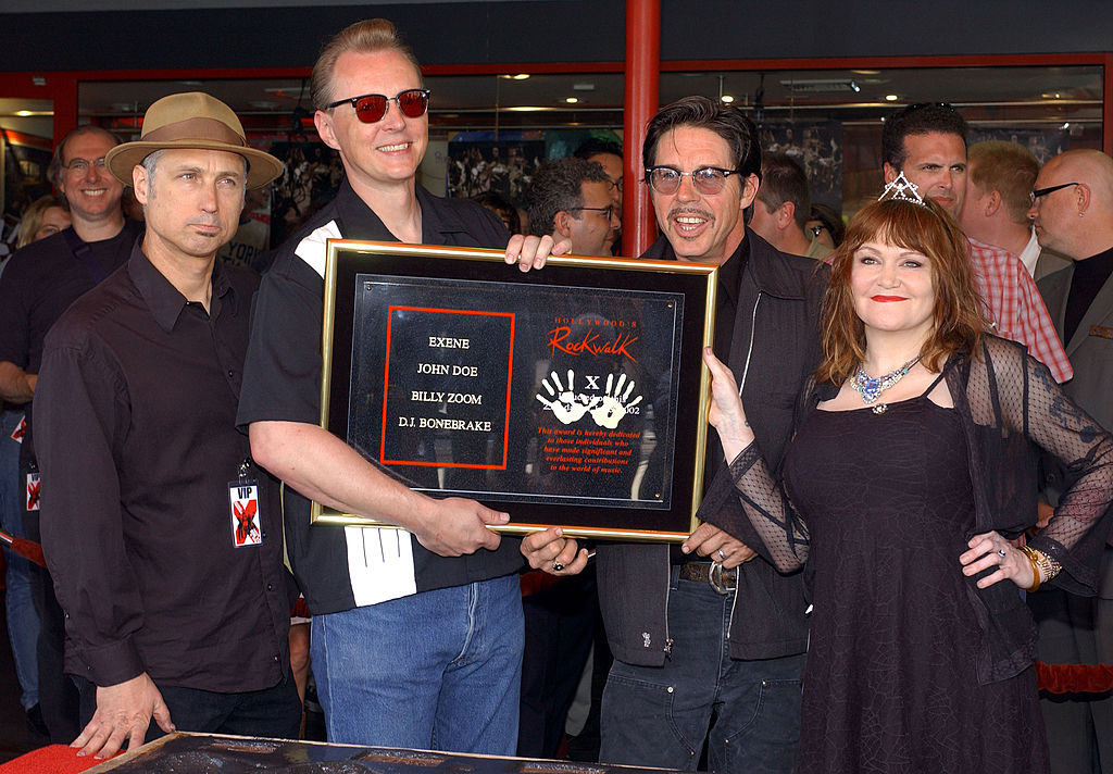 Members of the punk rock band "X" (L-R): DJ Bonebreak, Billy Zoom, John Doe and Exene Cervenka attend a handprint ceremony inducting the band into the Hollywood Rockwalk on June 25, 2002 in Hollywood, California