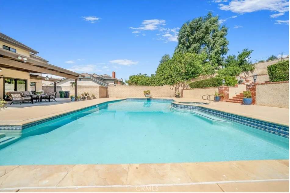 image from the real house used for the filming of the 1982 movie "Poltergeist." It is a shot of the swimming pool and Jacuzzi in the home's backyard.