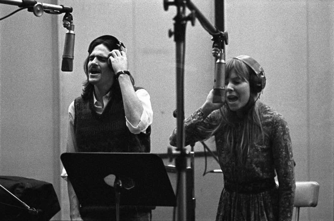 Singer-songwriters James Taylor and Joni Mitchell provide backing vocals during the recording of Carole King's album 'Tapestry' at A&M Records Recording Studio in January 1971 in Los Angeles, California, United States.