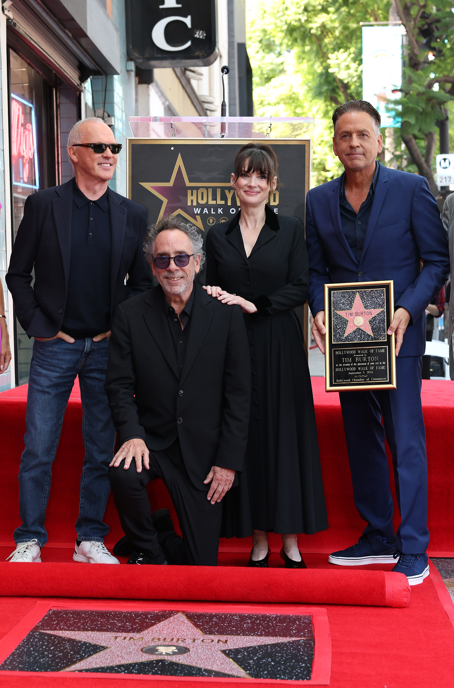 HOLLYWOOD, CALIFORNIA - SEPTEMBER 03: (L-R) Michael Keaton, Tim Burton and Winona Ryder attend Tim Burton honored with star on Hollywood Walk of Fame on September 03, 2024 in Hollywood, California.