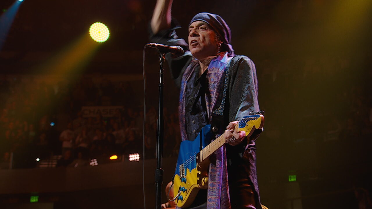 Stevie Van Zandt on stage in "Road Diary" documentary
