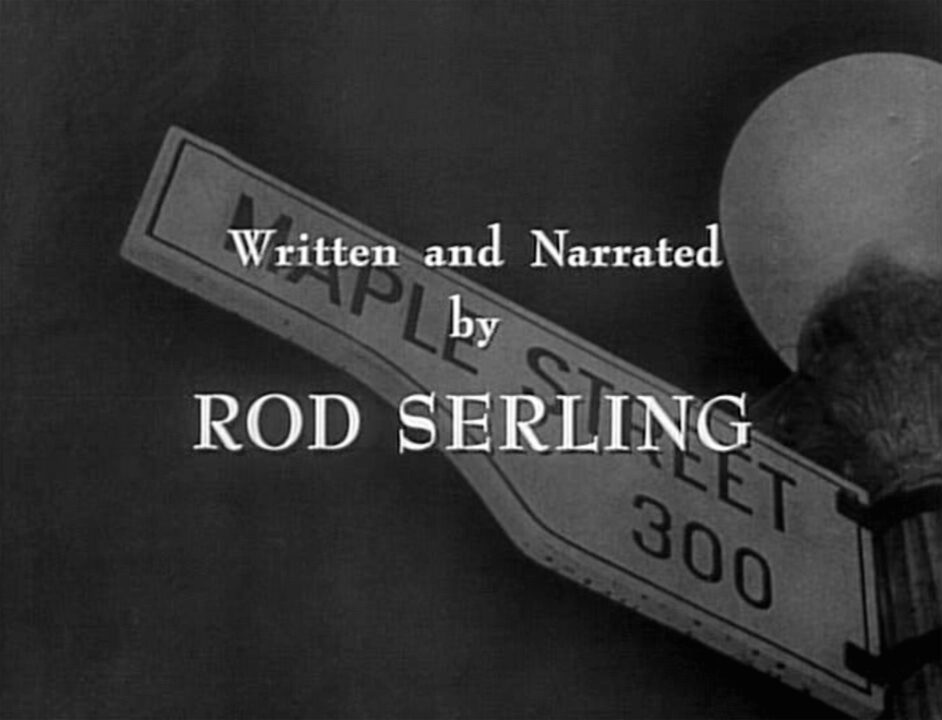 image from the 1960 "The Monsters Are Due on Maple Street" episode of "The Twilight Zone." It is an image from th closing titles of the episode; superimposed over an image of a street sign reading "Maple Street" is the credit: "Written and Narrated by Rod Serling."