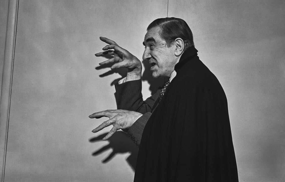 Actor Bela Lugosi gestures with his hands while posing in a cape, November 4th 1951.