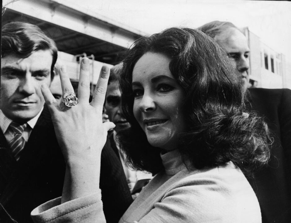 British-born actress Elizabeth Taylor shows off the 33.19 carat diamond ring given to her by husband Richard Burton