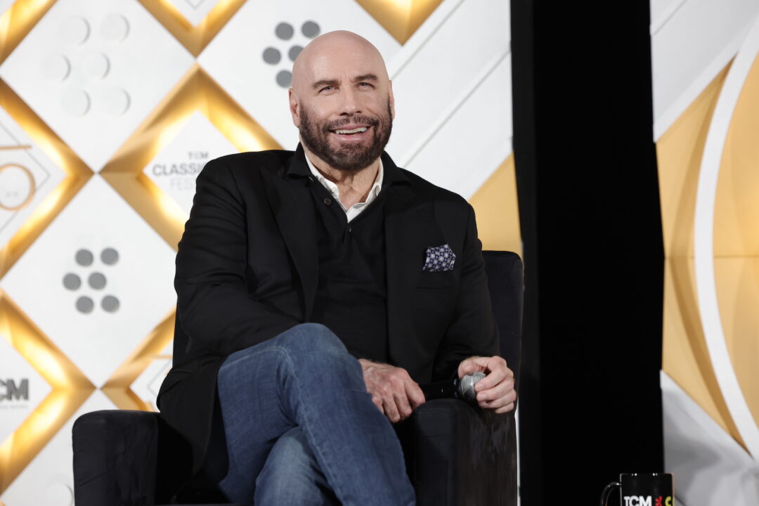 HOLLYWOOD, CALIFORNIA - APRIL 18: John Travolta speaks onstage at the Opening Night Gala and 30th Anniversary Screening of "Pulp Fiction" during the 2024 TCM Classic Film Festival at TCL Chinese Theatre on April 18, 2024 in Hollywood, California.