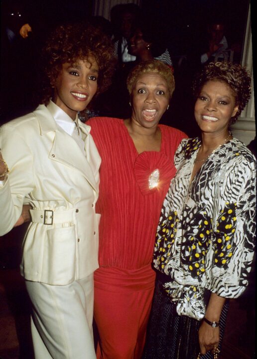 Singers Whitney Houston and her mother, Cissy Houston, with fellow singer Dionne Warwick attend Columbia Records party on December 19, 1987 in New York City, New York.