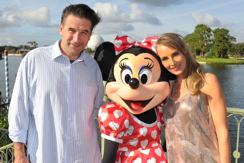 In this handout photo provided by Gene Duncan, actor William Baldwin and his wife, singer Chynna Phillips, pose with Minnie Mouse in Epcot at Walt Disney World Resort on October 15,2013 in Lake Buena Vista, Florida. Chynna Phillips, the lead singer of the musical trio Wilson Phillips, was performing at the theme park