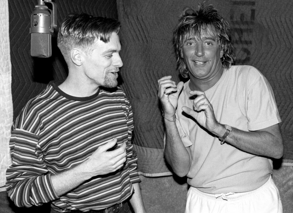 LOS ANGELES, CA - CIRCA 1993: Canadian guitarist, singer, composer, record producer, photographer, and philanthropist Bryan Adams and British rock and pop singer, songwriter, and record producer Rod Stewart in studio recording a song circa 1993 in Los Angeles, California. 