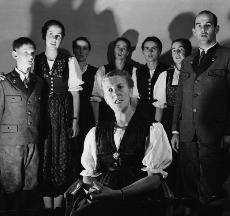 Portrait of the Baroness Maria Von Trapp (front, centre) singing with her children; (L-R) Johannes, Eleonore, Hedwig, Martina, Maria, Rosemarie and Werner, in London, circa 1950. 