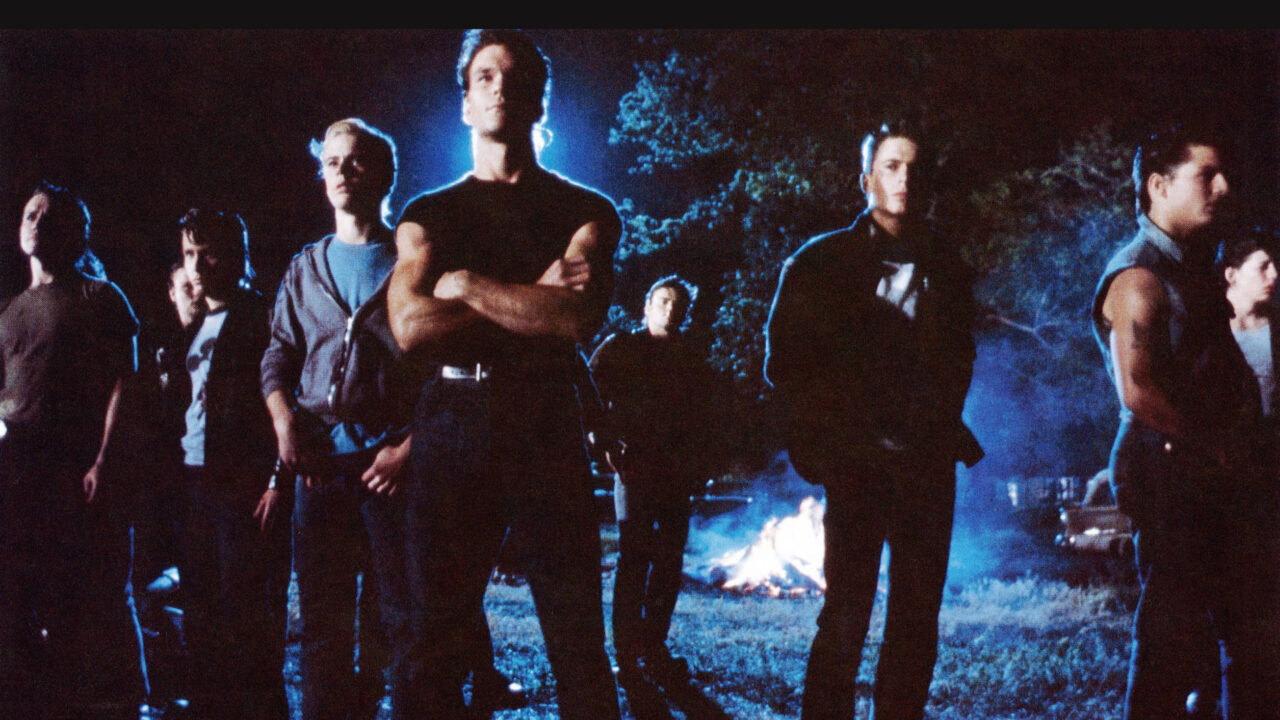 THE OUTSIDERS, front from left: C. Thomas Howell, Patrick Swayze (arms folded), Rob Lowe, Tom Cruise (facing right), 1983,
