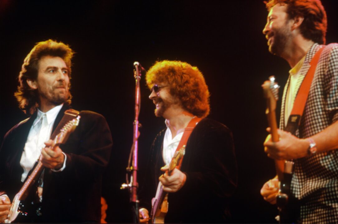 LONDON, UNITED KINGDOM - JUNE 05: George Harrison, Jeff Lynne and Eric Clapton at the Princes Trust Concert on June 05, 1987 in London, United Kingdom.