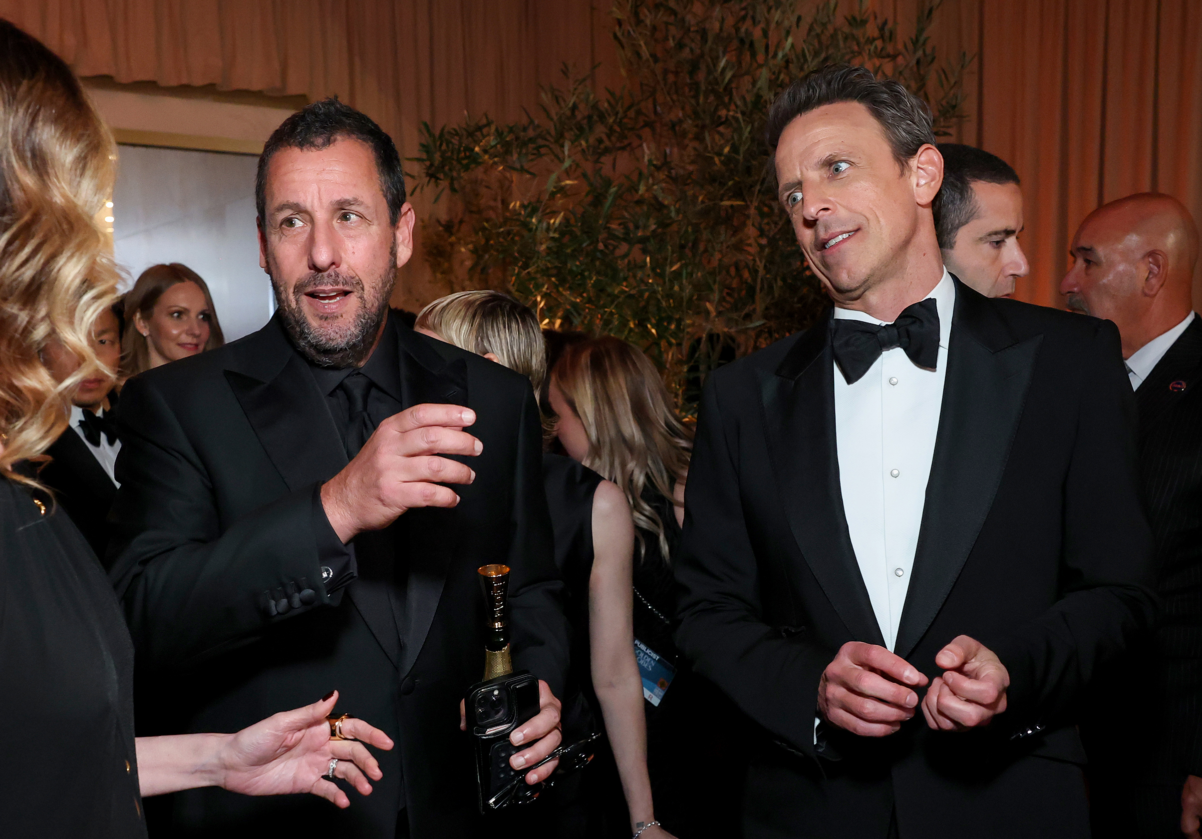 BEVERLY HILLS, CALIFORNIA - JANUARY 05: (L-R) Adam Sandler and Seth Meyers attend the 82nd Annual Golden Globe Awards at The Beverly Hilton on January 05, 2025 in Beverly Hills, California.