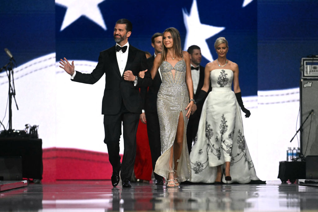 Sons of US President Donald Trump Eric Trump (2nd R) and son Donald Trump Jr. (L), his daughter Ivanka Trump (R) and granddaughter Kai Madison Trump attend the Liberty inaugural ball in Washington, DC, on January 20, 2025